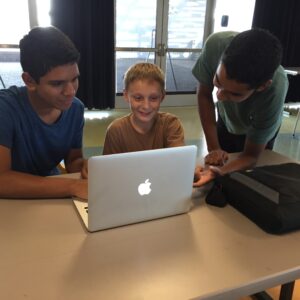 Students Teach Science and Programming to Local Youths Teaching in Action
